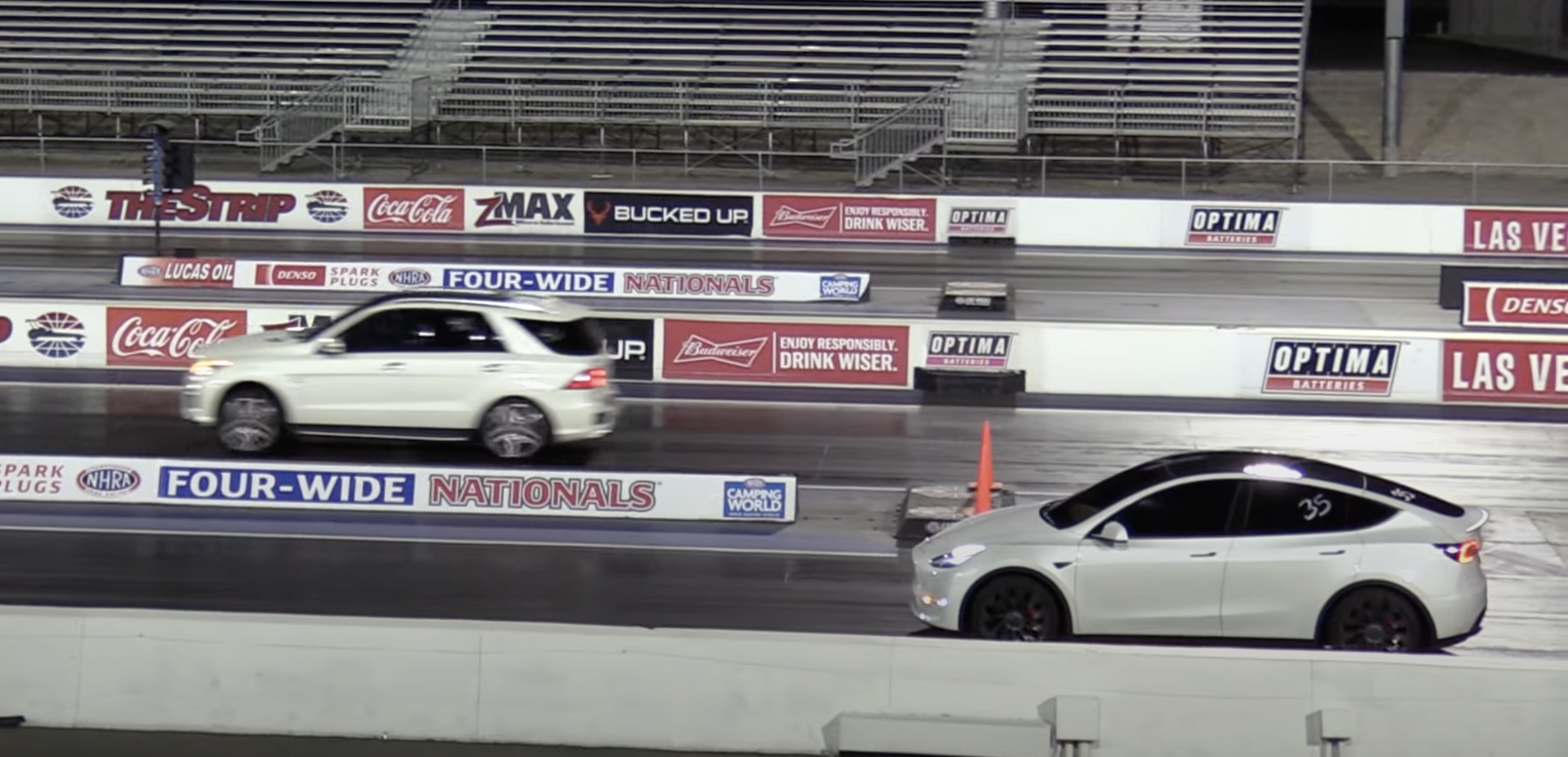 Tesla Model Y driver starts race in reverse still wins against AMG SUV
