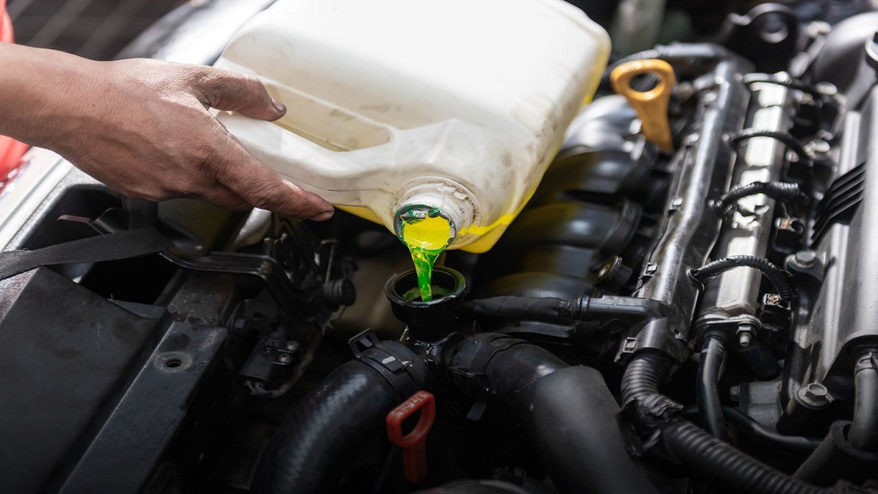 How do I flush and replace my car's coolant?