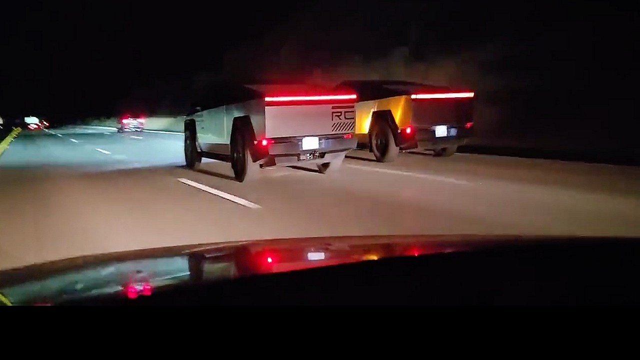 Twin Tesla Cybertrucks cruise down a highway in coordinated duo