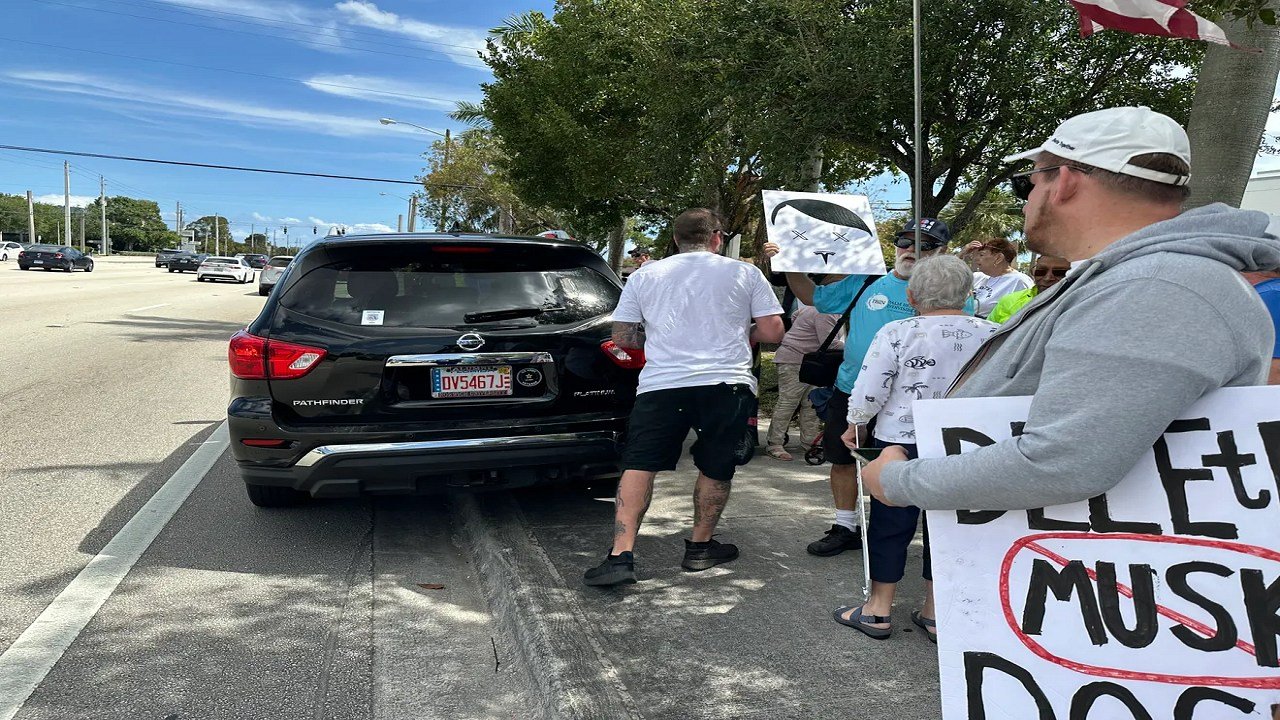 Florida Man Charged Trying To Hit Tesla Protestors