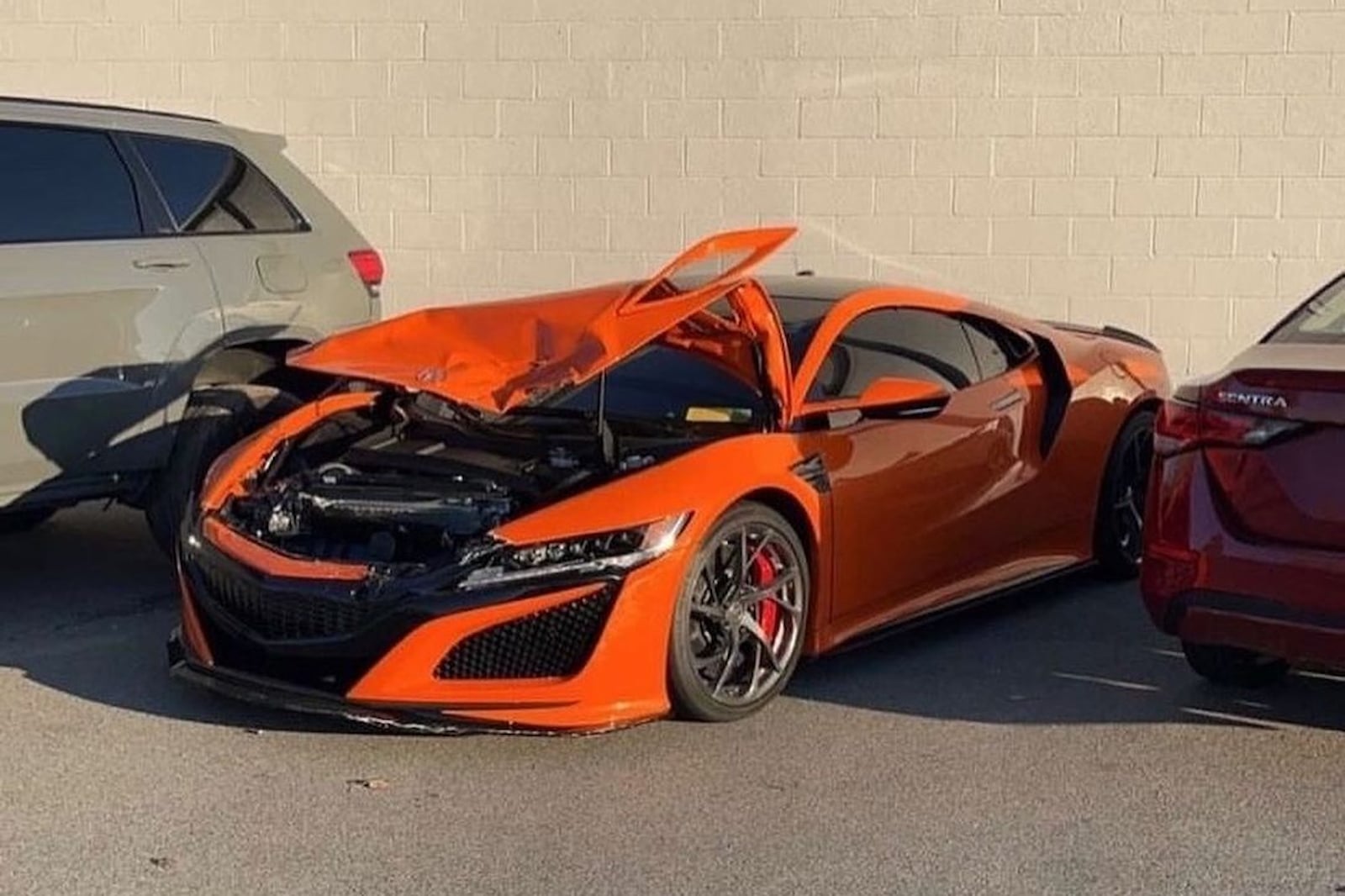 Acura NSX Runs Face-First Into A Jeep Wrangler At A Dealership