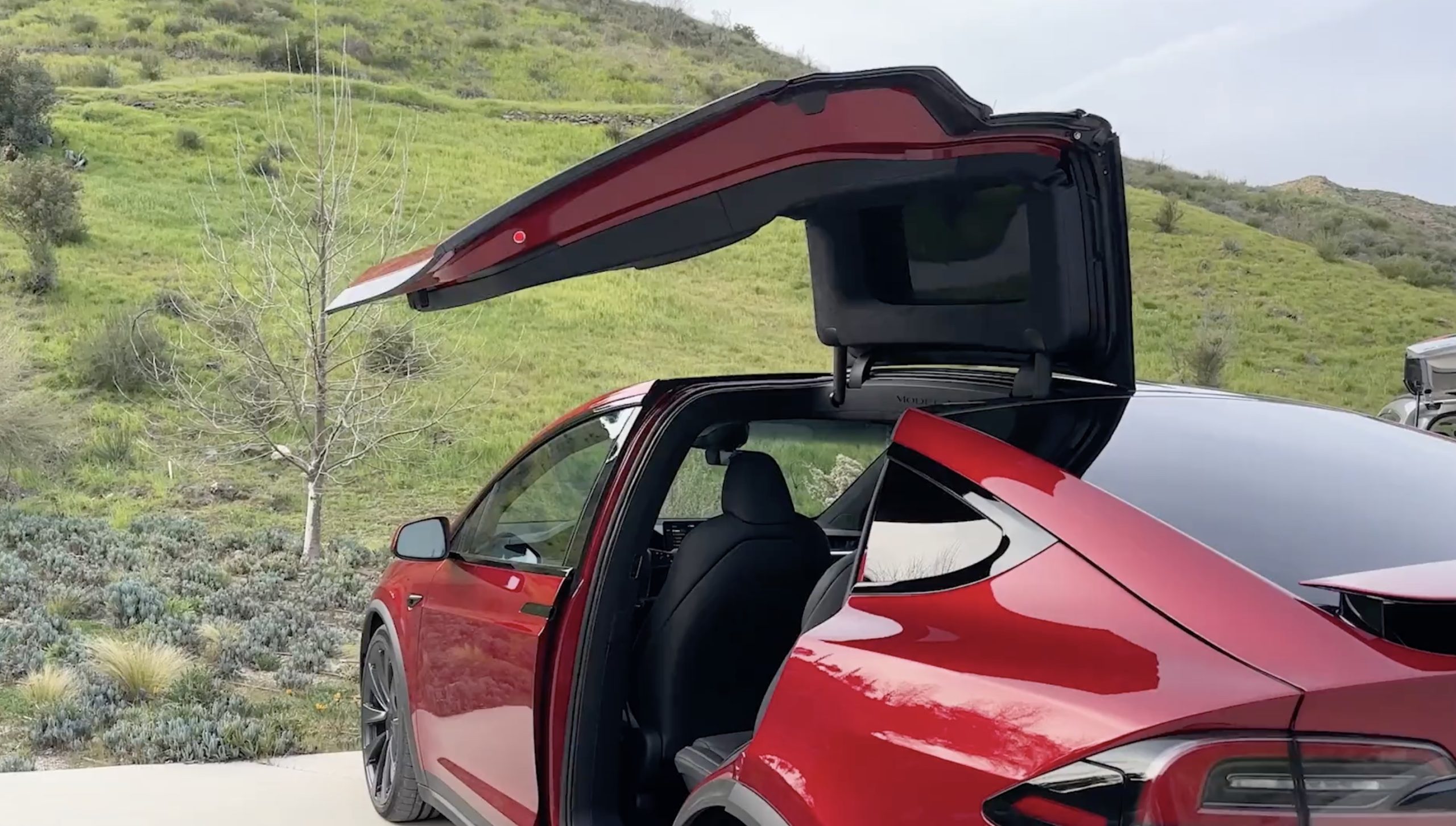Tesla shares old footage of Model S with Falcon wing doors