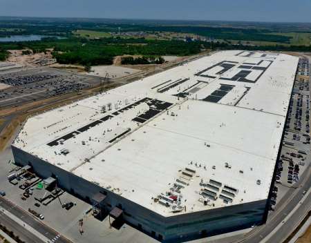 Teslas Self Inscription atop Gigafactory Texas with solar panels continues