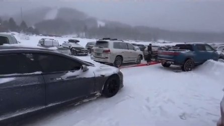 Watch Tesla Model S Drag A Stuck Rivian R1T Out Of The Snow